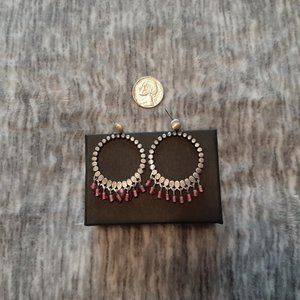 Silver tone pink dangle earrings